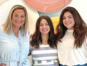 Meghan Martin, Jacqueline LaRocca, and Madison Christiansen Trout standing together, smiling.